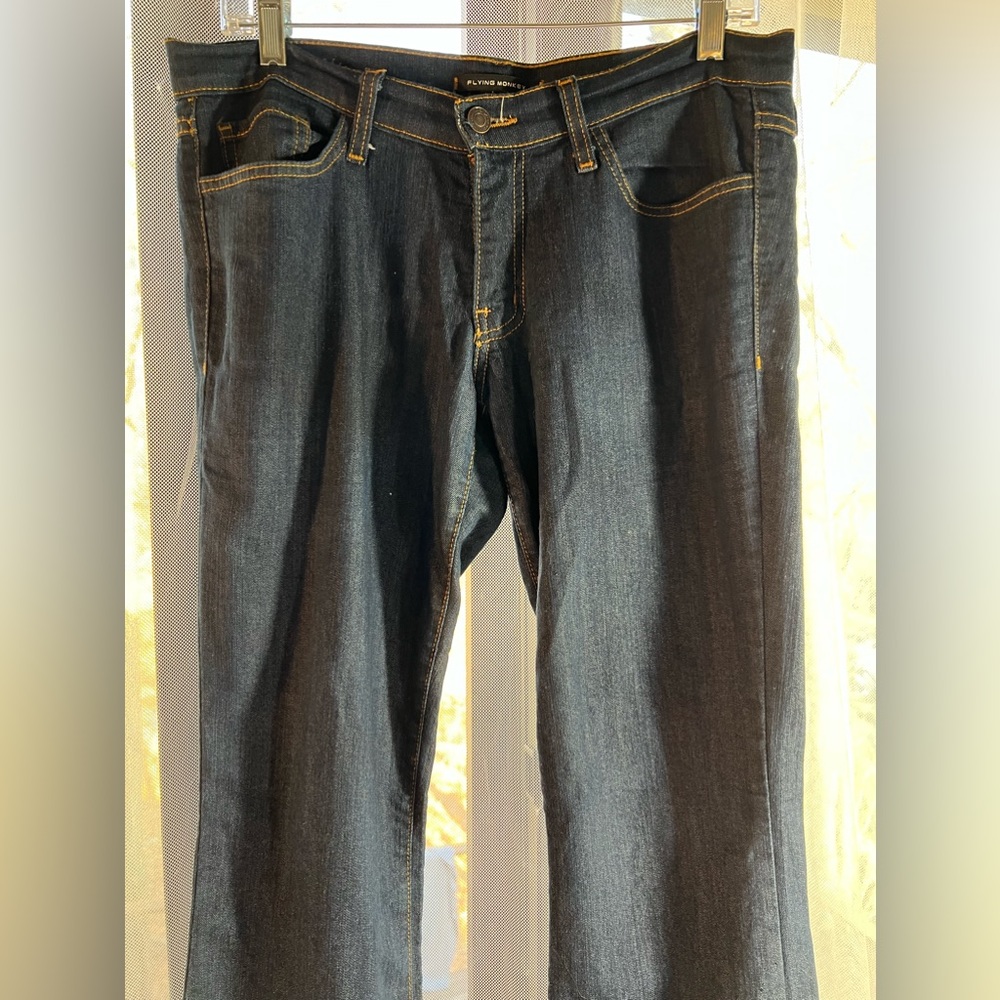 Flying Monkey dark blue jeans finished with orange stitch. Very cute. Size 29